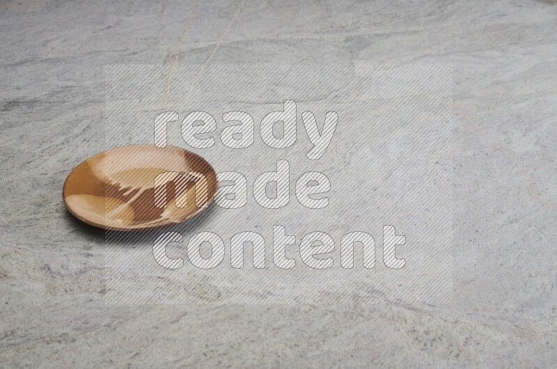 Multicolored Pottery Plate On Grey Marble Flooring