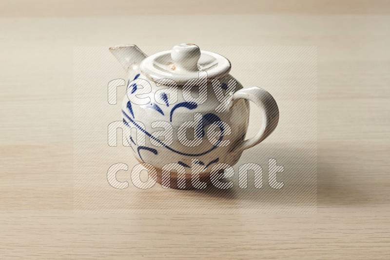Pottery teaPot on Oak Wooden Flooring, 15 degrees
