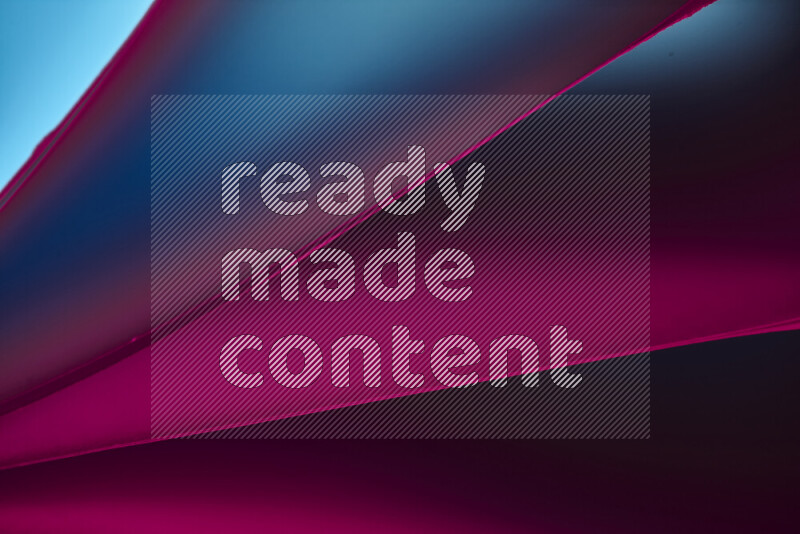 An abstract art piece displaying smooth curves in warm and cold gradients created by colored light