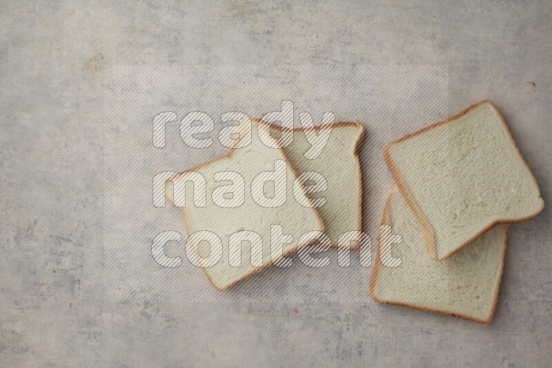 White Toast slices on alight blue textured background