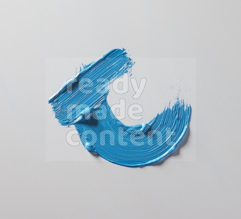 Multi blue curved brush strokes shaped into different shapes on a white background