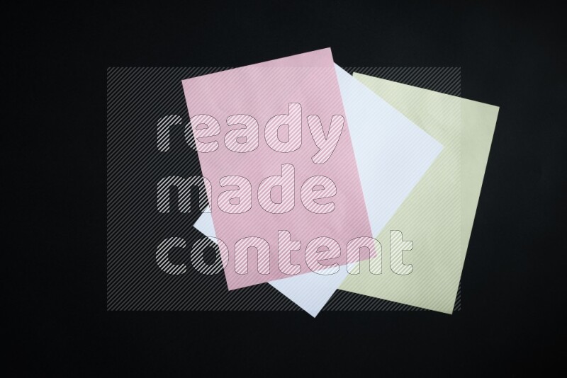 Multicolored paper sheet on black background