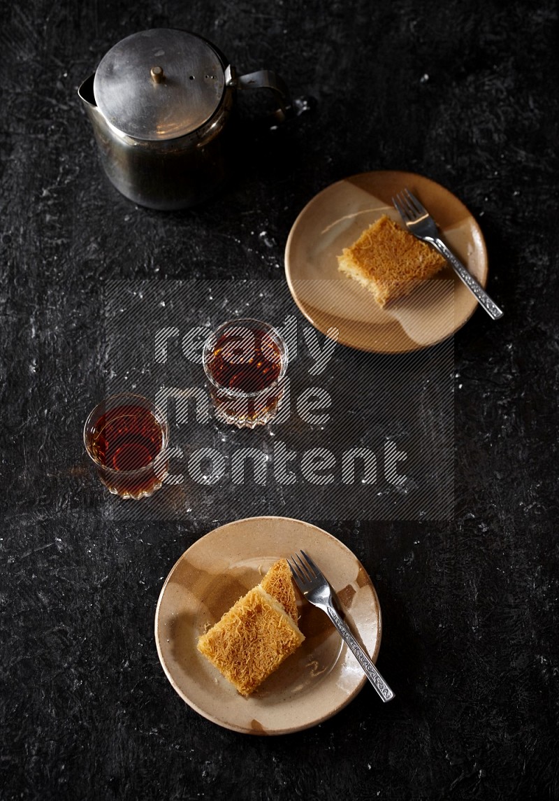 konafa with tea in a dark setup