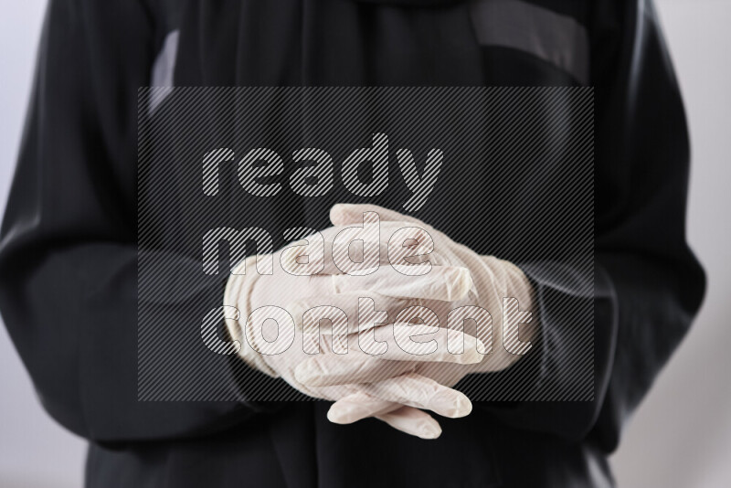 Female doctor wearing an abaya and medical attire in different positions