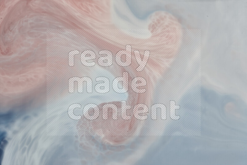 A close-up of abstract swirling patterns in blue, red and white