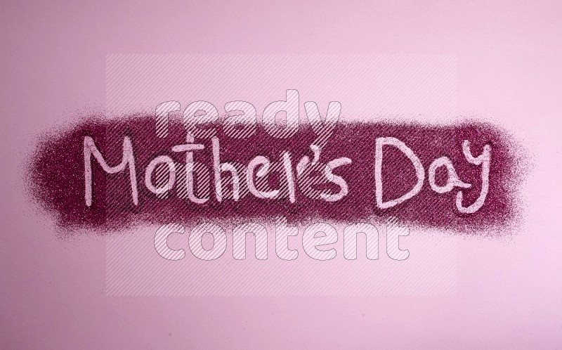 A sentence written with pink glitter on pink background