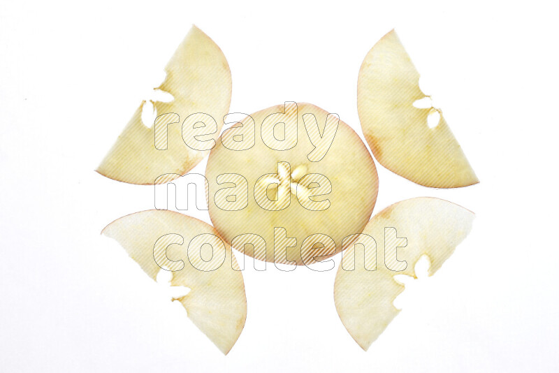 Apple slices on illuminated white background