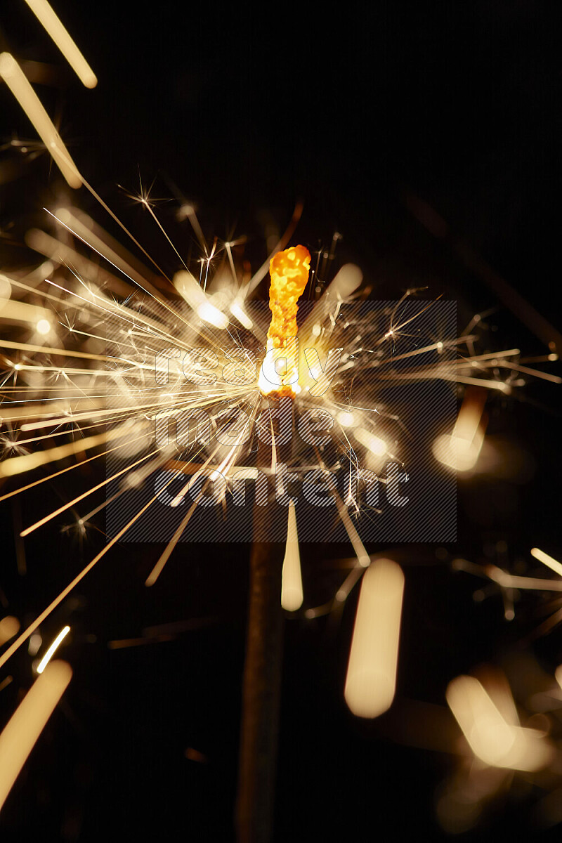 A close-up image of sparkler candle isolated on black background