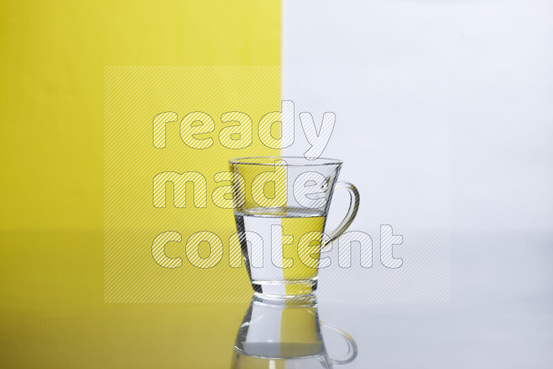 The image features a clear glassware filled with water, set against white and yellow background