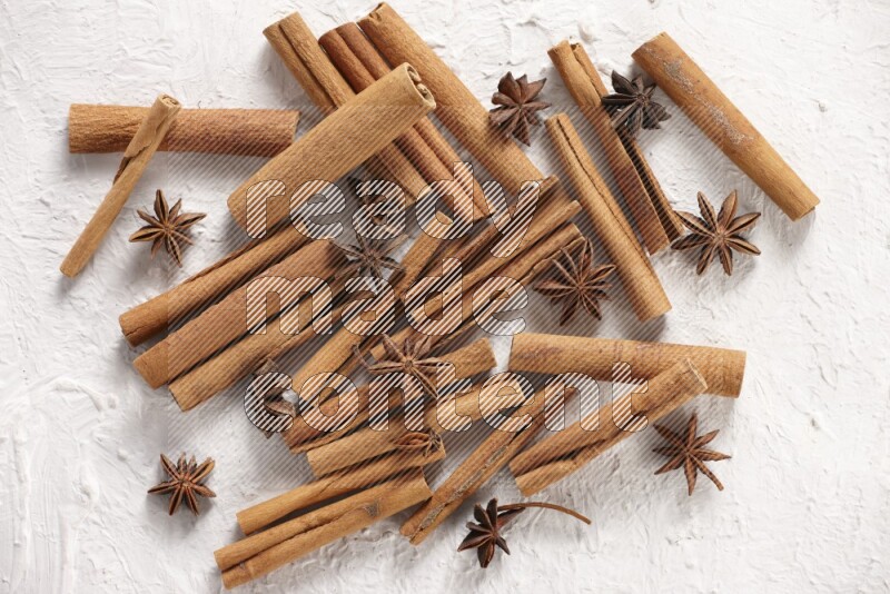 cinnamon sticks with star anise on white background