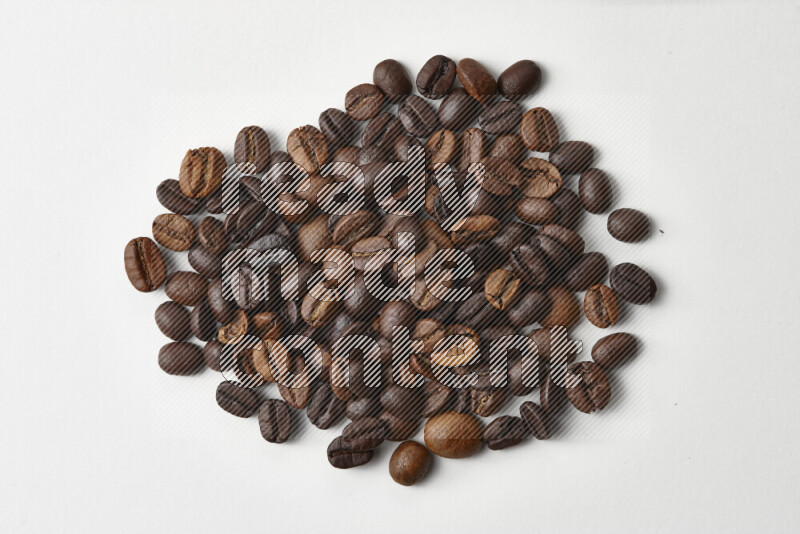Roasted coffee beans on white background