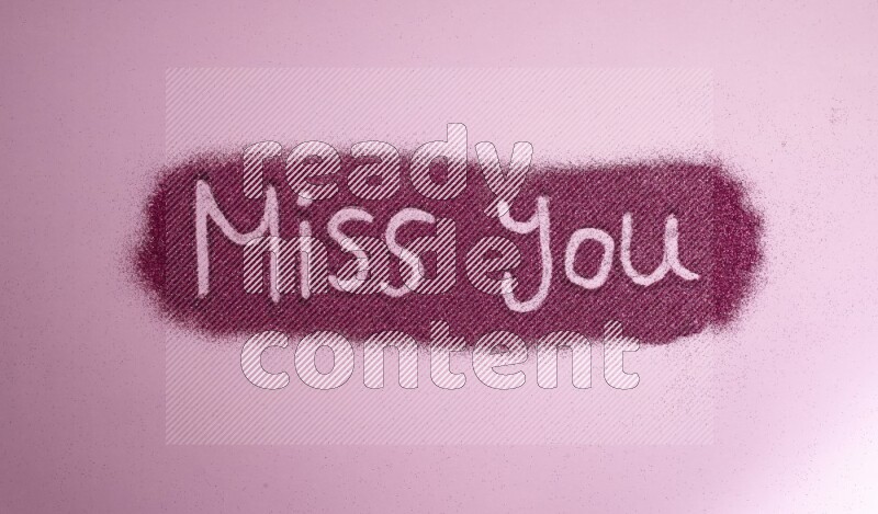 A sentence written with pink glitter on pink background