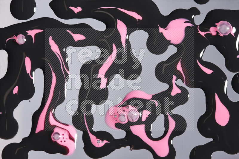 خلفية ملونة مع مزيج من ألوان الطلاء الوردي والاسود