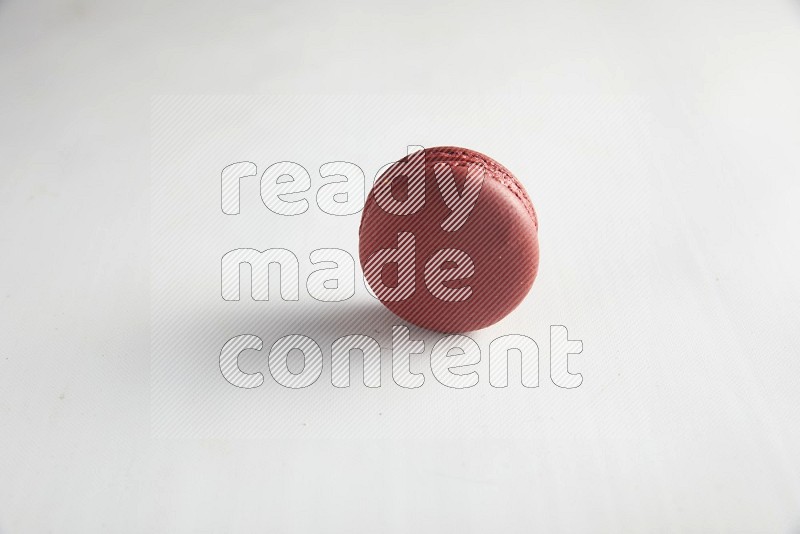 45º Shot of Red Velvet macaron on white background