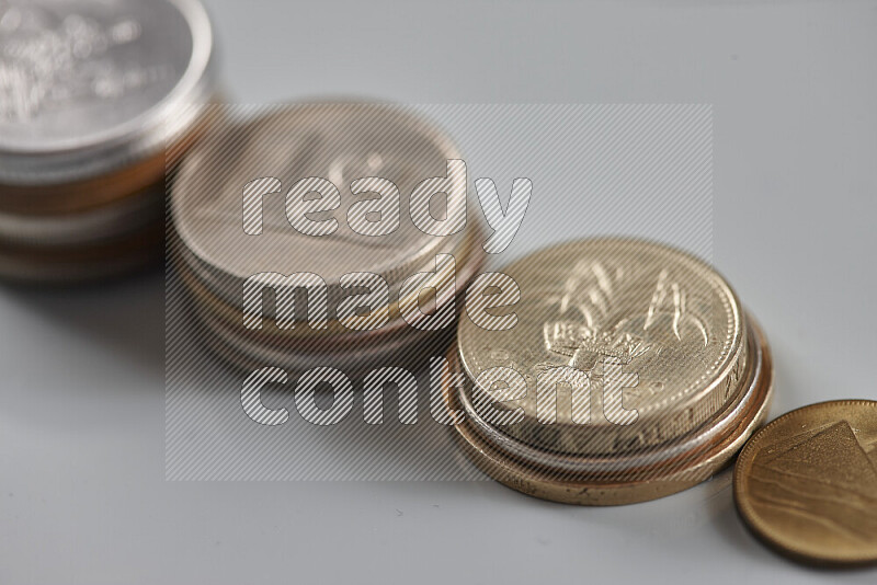Random old coins on grey background