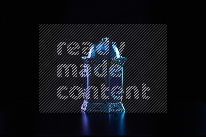 Ramadan lanterns with colored rim light against black background