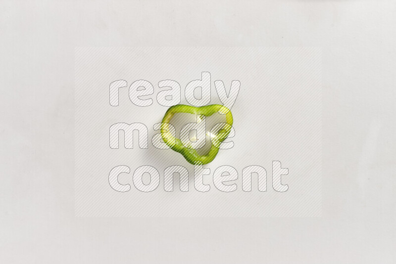 Green bell pepper slices on white background