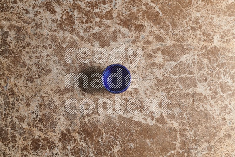 Top View Shot Of A Pottery Cup On beige Marble Flooring