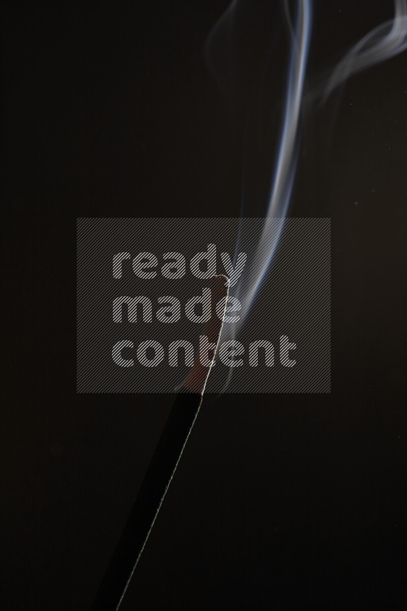 Motion of wavy smoke isolated on dark background