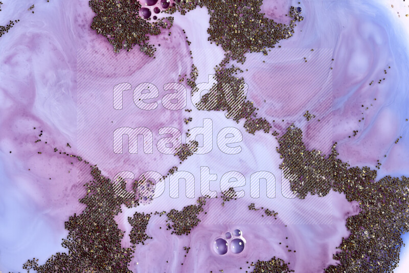 لقطة مقربة لبريق ذهبي متلألئ منتشر على خلفية من اللون الأزرق والأحمر في حركات دائرية