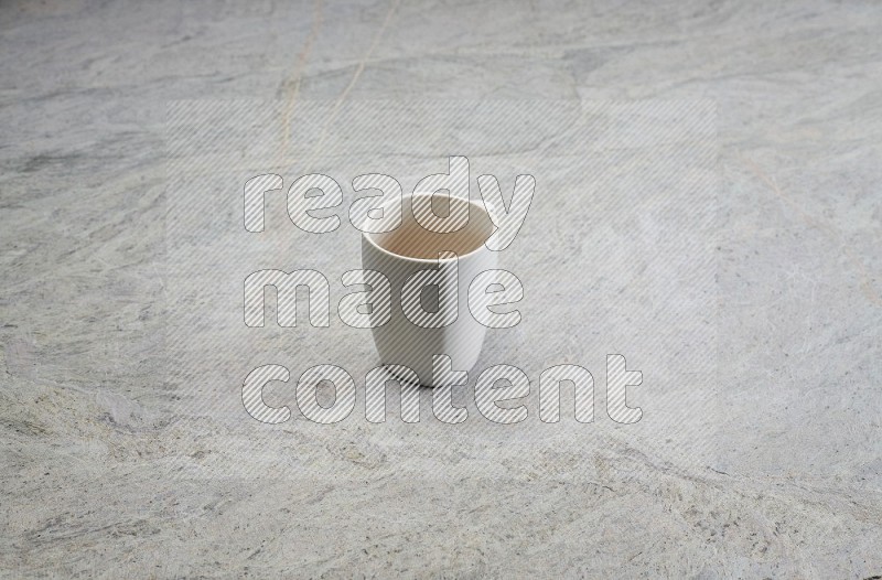 White Ceramic Mug On Grey Marble Flooring