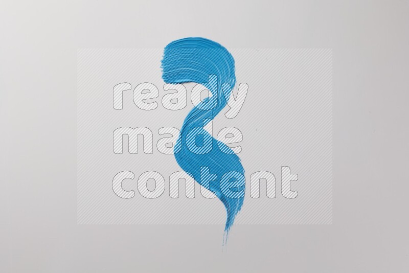 A single blue zigzag brush stroke on a white background