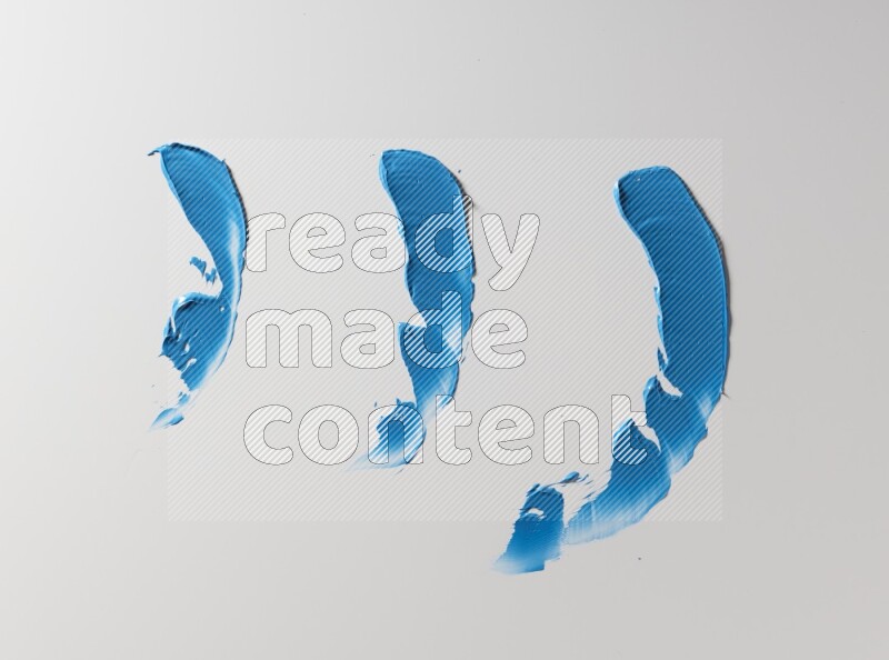 Blue painting knife strokes on white background