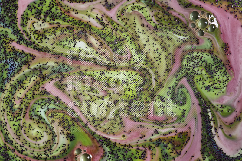 لقطة مقربة لبريق أرجواني متلألئ منتشر علي خلفية من اللون الأخضر والأحمر في حركات دائرية