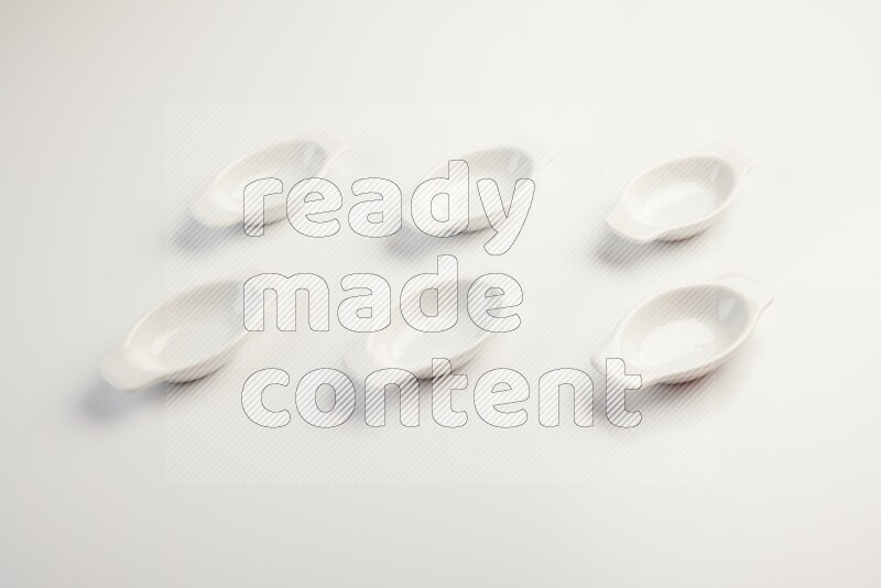 white ceramic oval sauce dish on white countertop