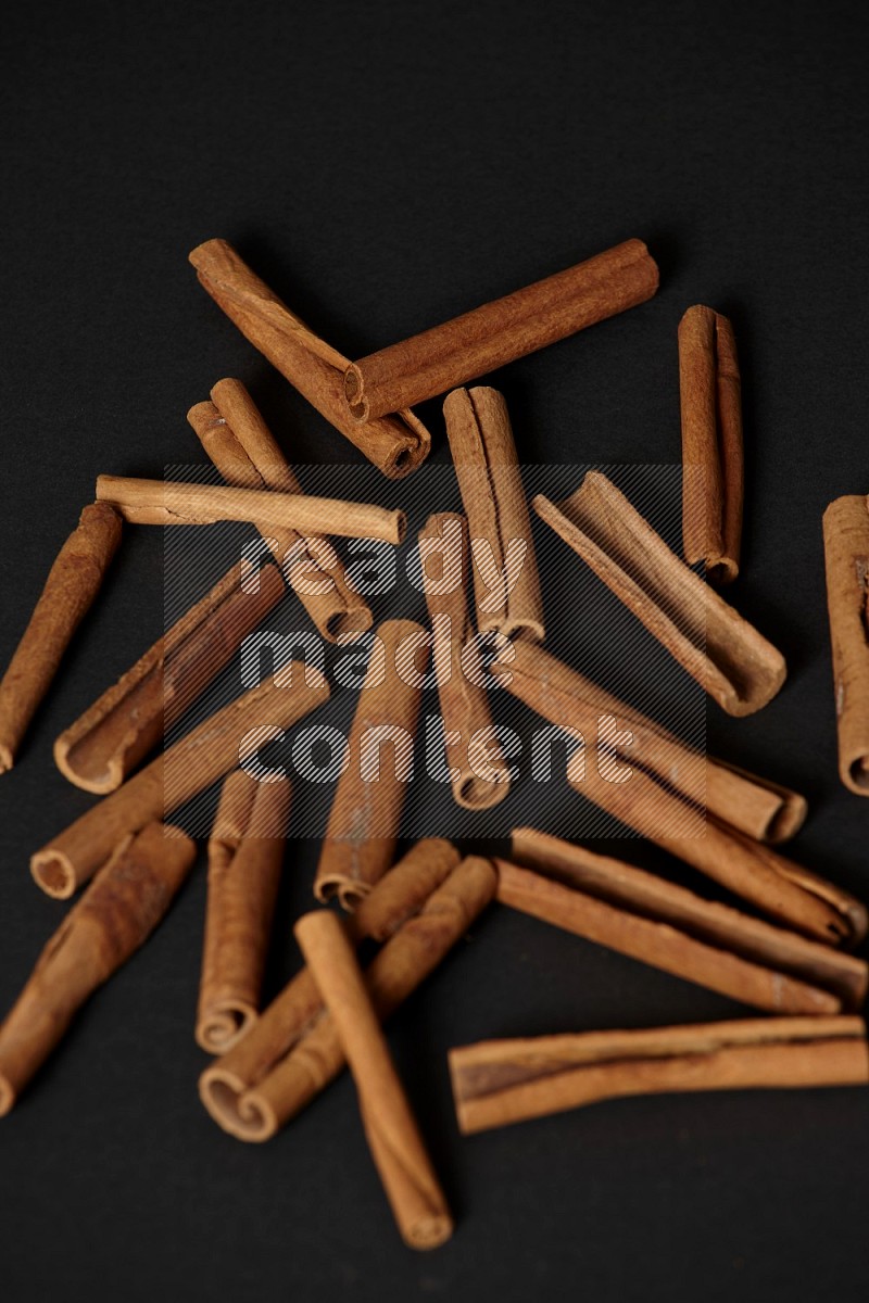 Cinnamon sticks on black background