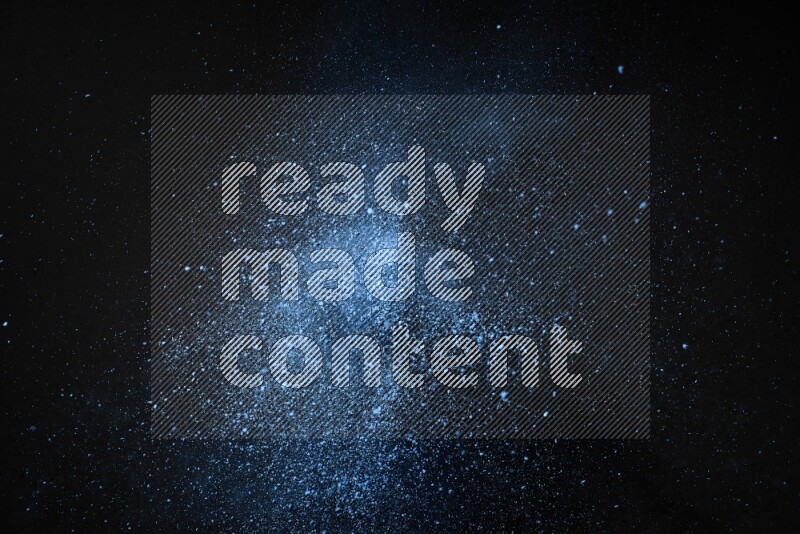 Blue powder explosion on black background