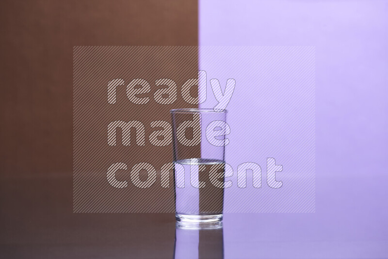 The image features a clear glassware filled with water, set against brown and light purple background