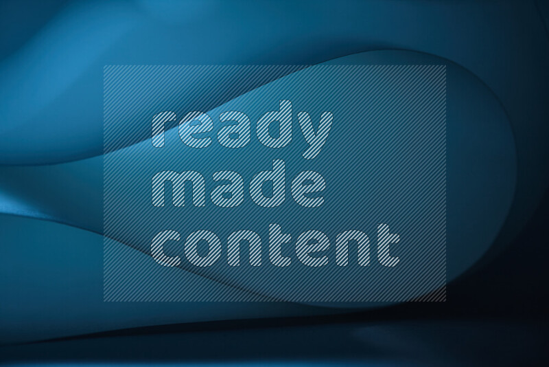 فن تجريدي يعرض منحنيات وتدرجات اللون الأزرق مكونه بضوء ملون