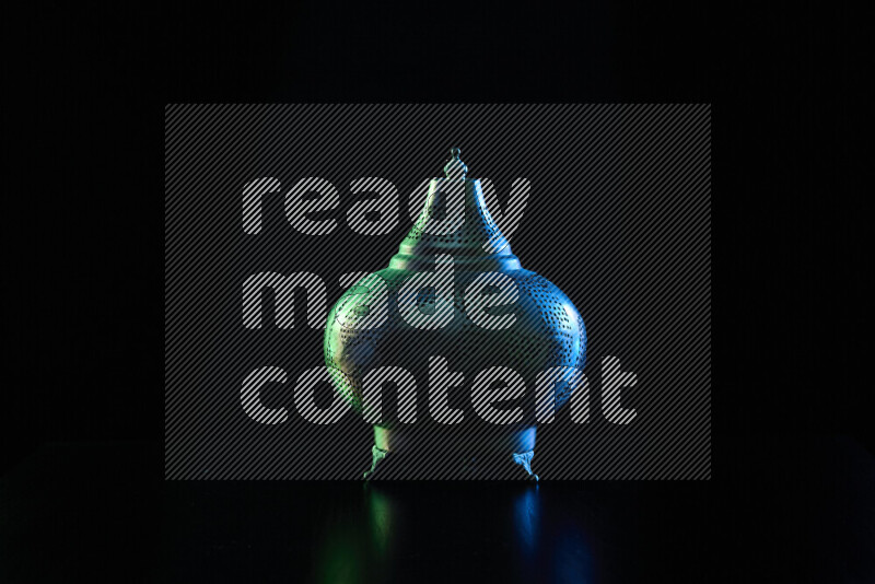 Ramadan lanterns with colored rim light against black background