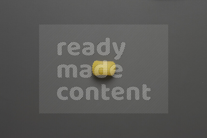 Elbow pasta on grey background
