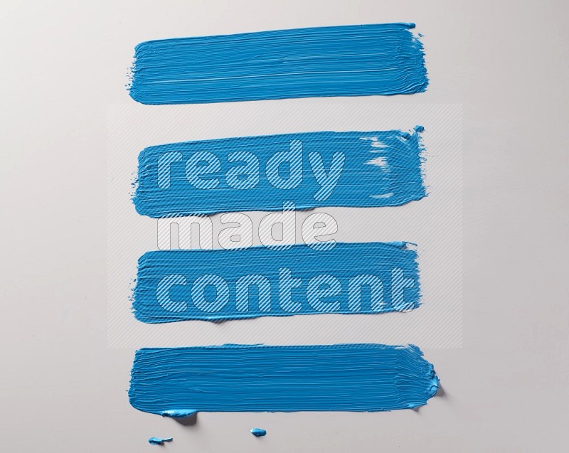 Multi blue straight brush strokes in different shapes on a white background