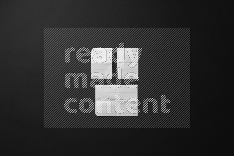 Ripped notebook sheet on black background