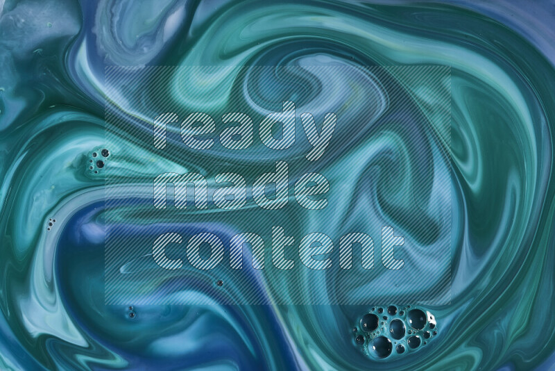 A close-up of abstract swirling patterns in blue and green