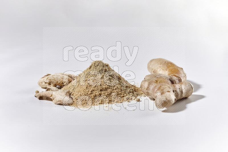 A bunch of ground ginger powder on white background