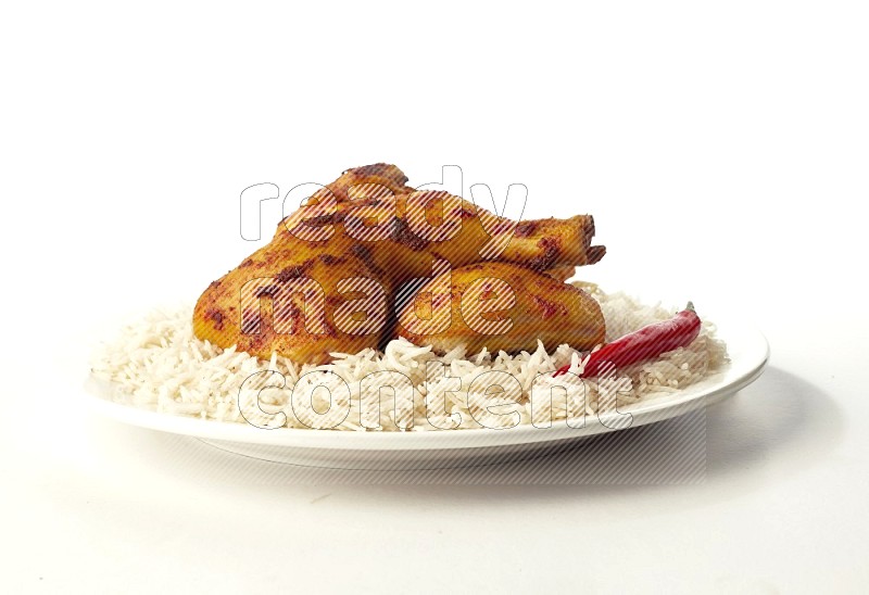white  basmati Rice with  kabsa chicken pieces  on a white rounded plate direct on white background