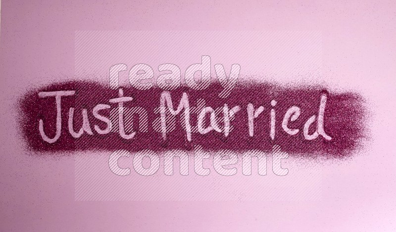 A sentence written with pink glitter on pink background