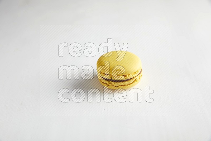45º Shot of Yellow Lemon macaron on white background