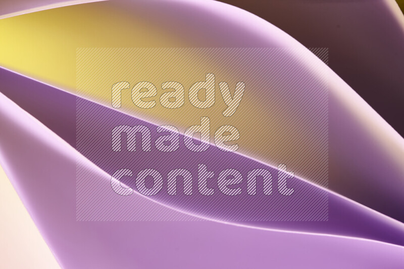 This image showcases an abstract paper art composition with paper curves in purple and gold gradients created by colored light