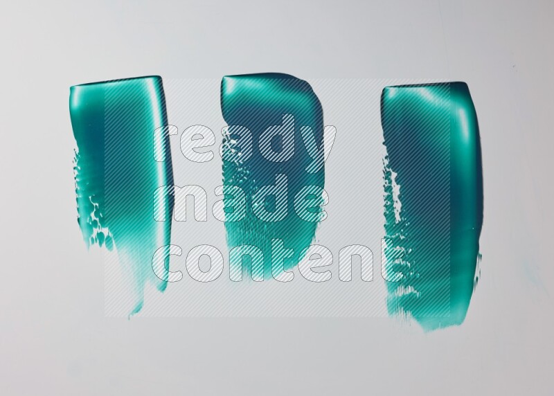Turquoise painting knife strokes on white background