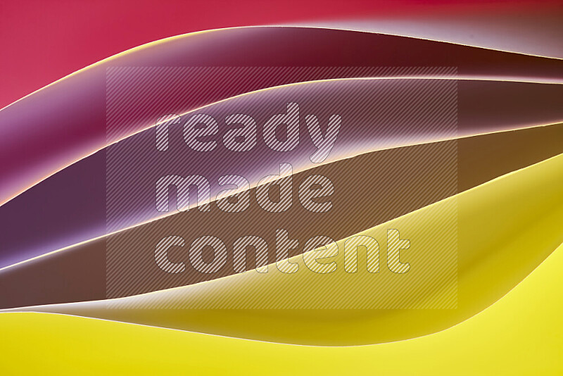 This image showcases an abstract paper art composition with paper curves in yellow, red and brown gradients created by colored light