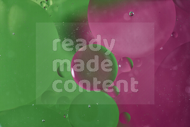 Close-ups of abstract oil bubbles on water surface in shades of green and pink