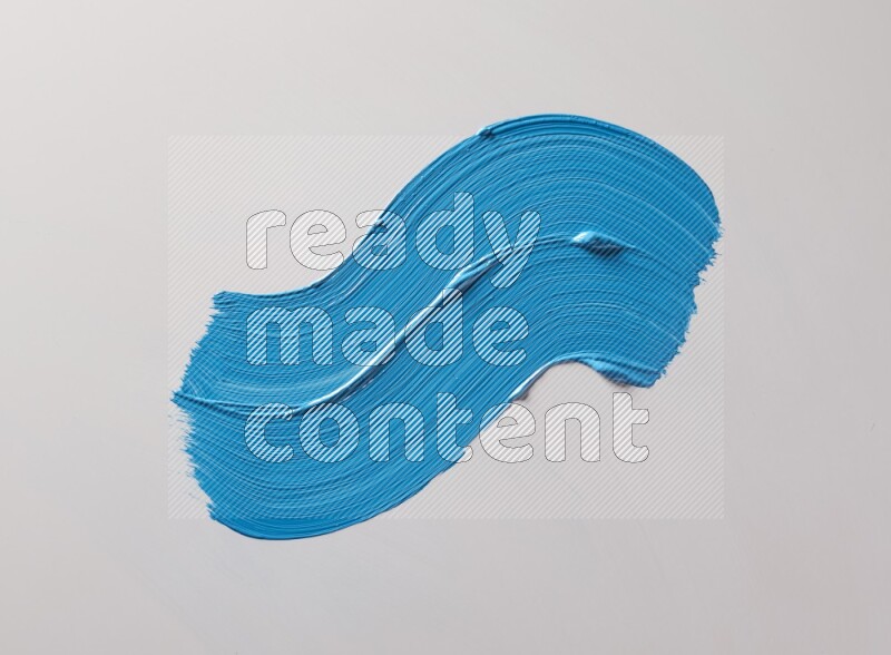 Multi blue curved brush strokes shaped into different shapes on a white background