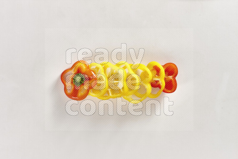 Assorted bell pepper slices on white background