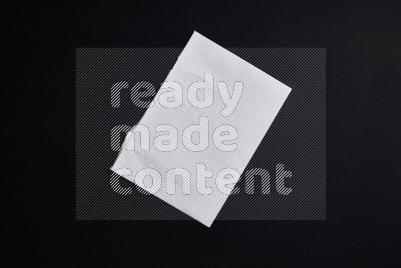 Notebook sheet on black background