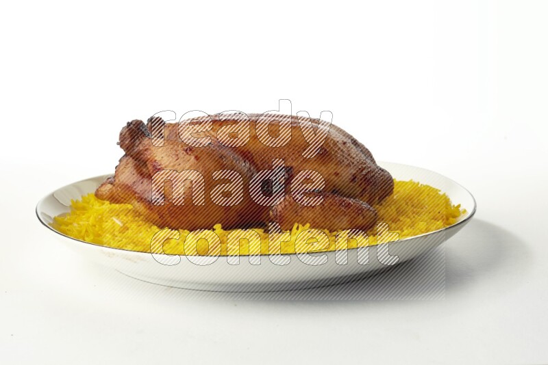 yellow  basmati Rice with kabsa chicken pieces on a white plate with a silver rim direct on white background